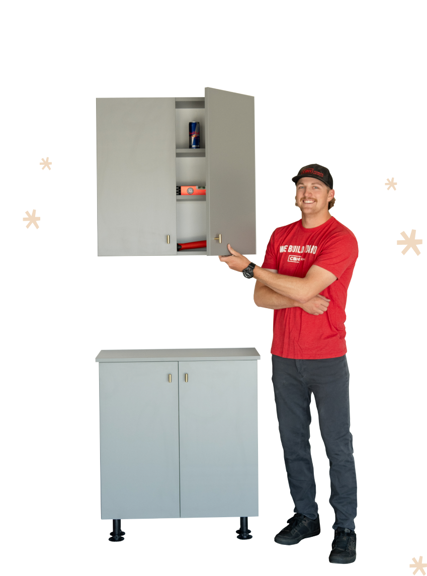 Man standing next to garage cabinets