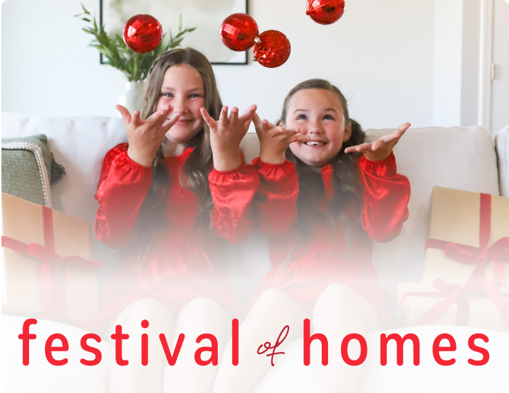 Two girls tossing ornaments - captioned Festival of Homes