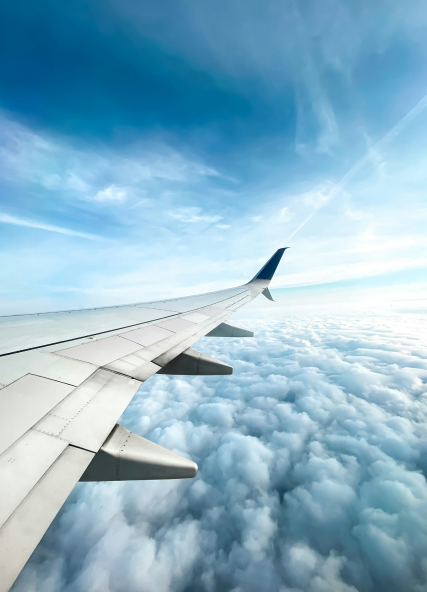 View of airplane wing through passenger window