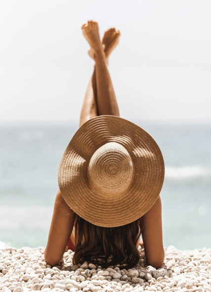 Vacationing woman wearing hat