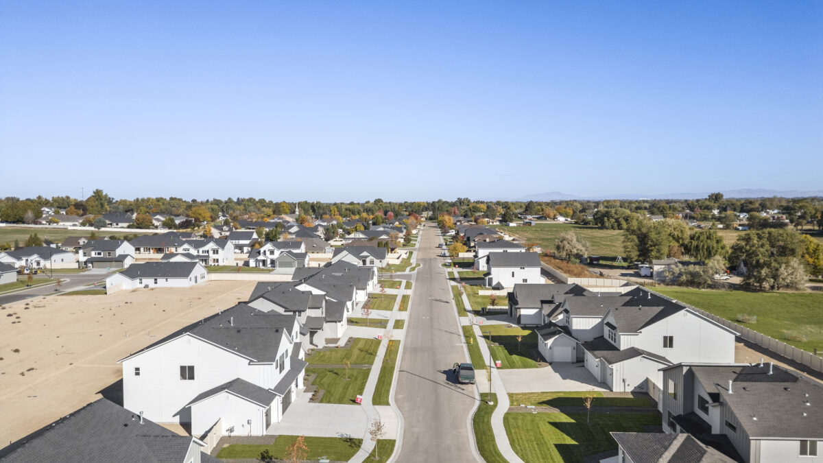drone flying down the street of Jack's place