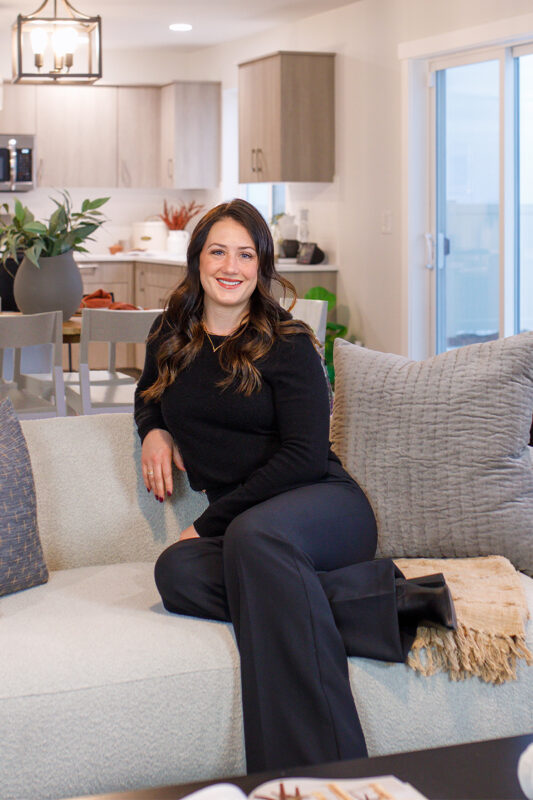 Alexis Roemer, listing agent at CBH Homes, smiling and wearing a black shirt