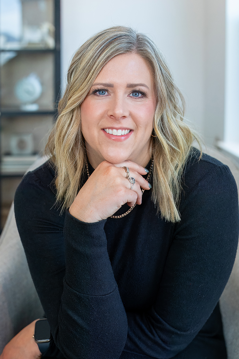 Lonneka Nagle, listing agent at CBH Homes, smiling and wearing a black shirt