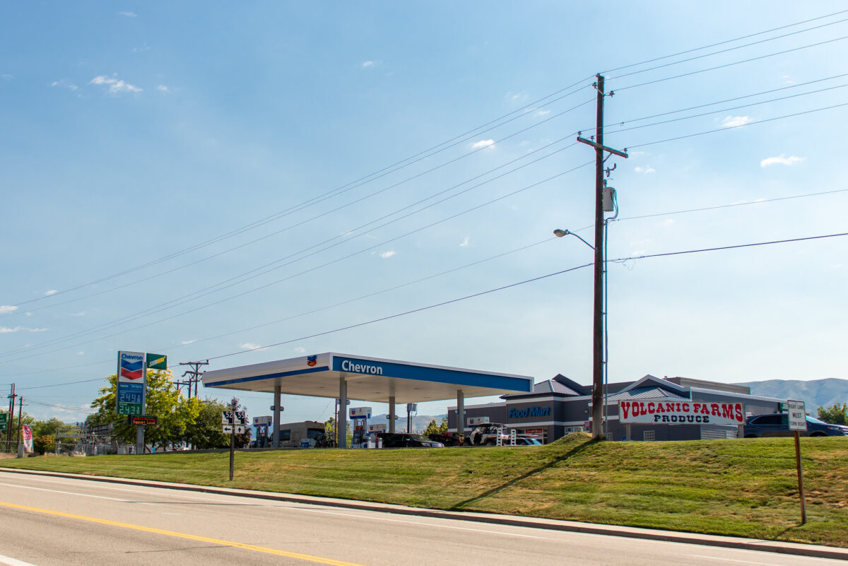 Valley View Chevron gas station and Volcanic Farms Produce stand on Highway 55 in Horseshoe Bend, Idaho, featuring clear skies and community landmarks
