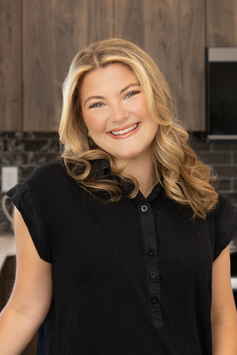 Professional headshot of Savannah Burkett, CBH Homes sales specialist, helping Treasure Valley homebuyers find their perfect new home.