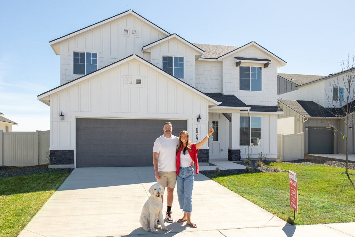 2026 homeowners in front of their CBH home