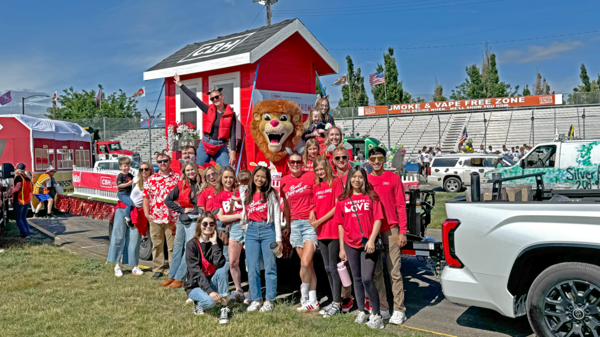 CBH Homes team and parade float at Dairy Days Meridian Idaho with Built Different shirts and lion mascot