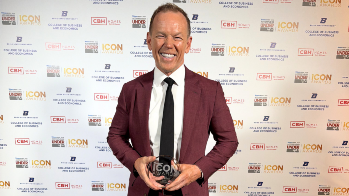 Corey Barton, Owner, Founder, and President of CBH Homes, holds his 2026 Idaho Business Review ICON Award trophy at the awards ceremony in Boise, Idaho.